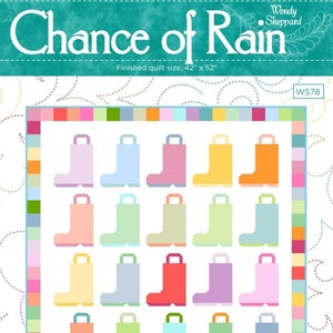 May include: A quilt pattern called "Chance of Rain" by Wendy Sheppard. The pattern features a grid of 20 colorful rain boots, each with a different color and design. The finished quilt size is 42 inches by 52 inches.