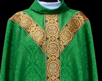 May include: Green liturgical vestment with gold and red trim. The vestment has a damask pattern and features a decorative design of circles and crosses.