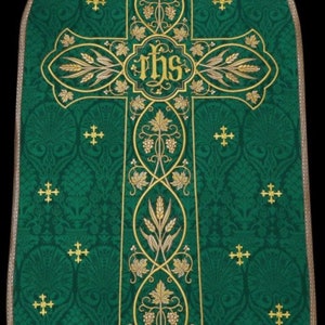 May include: Green liturgical vestment with a gold embroidered cross and the letters "IHS" in the center. The cross is decorated with grapevines and wheat stalks.