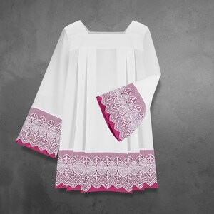 May include: White liturgical garment with pink lace trim. The lace trim is on the sleeves and the bottom of the garment.