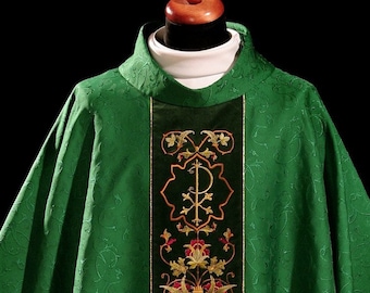 May include: Green liturgical vestment with a gold embroidered design featuring a cross and floral motifs.
