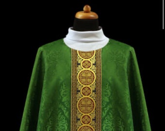 May include: A green liturgical vestment with gold and red trim. The vestment has a pattern of small floral designs.