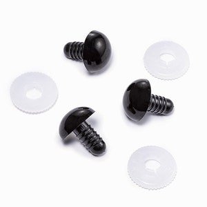May include: Four black plastic safety eyes with white plastic washers. The eyes have a screw-on back.