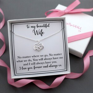 May include: A white gift box with a pink ribbon contains a silver necklace with an infinity heart charm. The box has a card inside that reads "To my beautiful Wife" and "No matter where we go, No matter what we do, You will always have me and I will always have you. I love you, forever and always xx".
