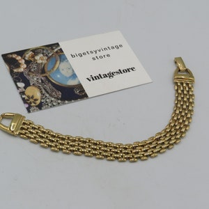 beautiful vintage gold tone panther link bracelet, excellent condition, lovely weight, 7.5-inches in length, 1.2cm width