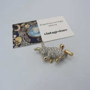 gorgeous vintage gold and silver tone hare/rabbit brooch filled with clear rhinestones, stunning design, green rhinestone eye......