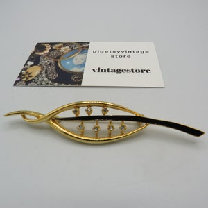 beautiful vintage gold tone leaf style brooch, clear rhinestones and black enamel, beautiful design in excellent condition, 3.5-inch length