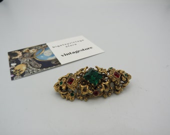 amazing vintage gold tone brooch, beautiful ornate detailing with coloured rhinestones, beautiful piece, lovely condition ......
