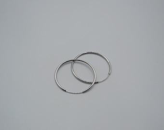 lovely simple 925 silver hoop earrings , large hoops, 4.5cm diameter , lovely quality , great condition , plain but effective, hoop earrings