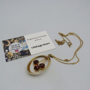 gorgeous vintage gold tone necklace/pendant, beautiful design with champagne rhinestones, 24-inch chain, 5cm pendant .......