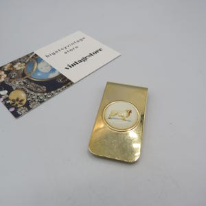 splendido fermasoldi vintage color oro con l'immagine di uno spaniel, pezzo adorabile in condizioni eccellenti, può essere usato come segnalibro, lunghezza 5 cm