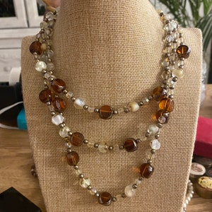 Stunning multi strand vintage glass bead necklace , beautiful clasp , slight piece missing from clasp , unnoticeable and works perfect , 16”