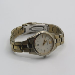 mooie vintage goudkleurige roestvrij staal seiko saffierkristal horloge, waterbestendig, 7N82-0GT0, goede conditon, heeft batterij nodig