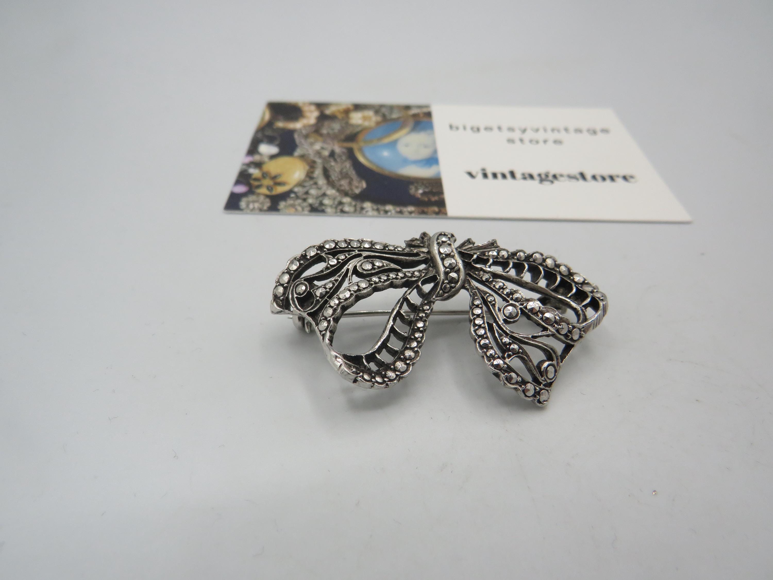 Vintage Silver Bow Brooch with Black Center Stone and Marcasite What are the letters on the back of a marcasite bow brooch? main image 2