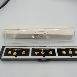 ADRIEN MANN  3 x necklace and earrings sets, gold plated, great condition, post back earrings, 16-inch chains, beautiful designs.........