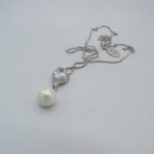 spectacular silver tone JON RICHARD SIGNED necklace with stunning clear glass and faux pearl handing pendant, immaculate, 16 to 18-inch.....