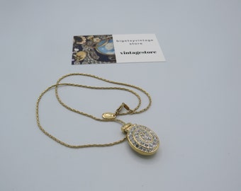 gorgeous vintage gold tone M&S locket necklace with a beautiful clear rhinestone swirl design, high quality piece in great condition.......