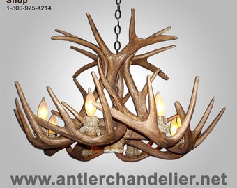 May include: A chandelier made from antlers with six light bulbs. The chandelier is hanging from a chain. The text "Antler Chandelier Shop" and "1-800-975-4214" is visible in the image. The website address "www.antlerchandelier.net" is also visible in the image.