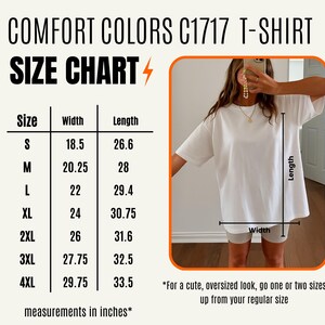 May include: White Comfort Colors C1717 T-shirt. The image includes a size chart with measurements in inches for sizes S to 4XL. The chart shows the width and length of the shirts. The text on the image says "For a cute, oversized look, go one or two sizes up from your regular size."