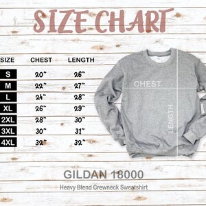 May include: A size chart for a grey Gildan 18000 Heavy Blend Crewneck Sweatshirt. The chart lists sizes S to 4XL, with chest measurements from 50.8cm to 81.3cm and lengths from 66cm to 81.3cm. The text "SIZE CHART" is at the top.