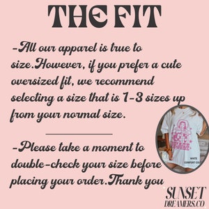 May include: A white t-shirt with a pink graphic of a cowgirl and the text "SPACE COWGIRL". The text "THE FIT" is at the top, with size recommendations and a reminder to double-check sizes before ordering. The brand name "SUNSET DREAMERS.CO" is at the bottom.