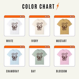 May include: Color chart showing different t-shirt colors. The t-shirts feature a brown dog graphic with the text "Charly" on the front. The colors are white, ivory, mustard, Chambray, bay, and blossom.