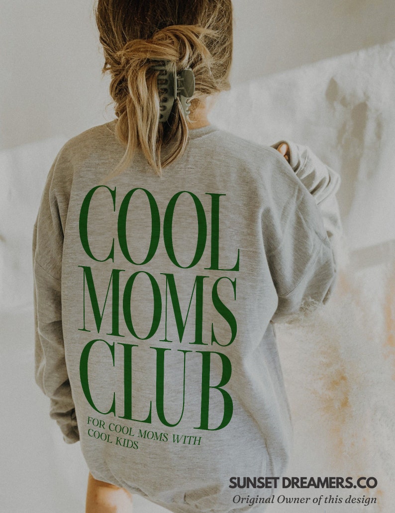 May include: Gray sweatshirt with the text "COOL MOMS CLUB" in green letters. The text "FOR COOL MOMS WITH COOL KIDS" is printed below the main text.