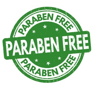 May include: Green round stamp with the text "PARABEN FREE" in white lettering. The text is repeated around the edge of the stamp.