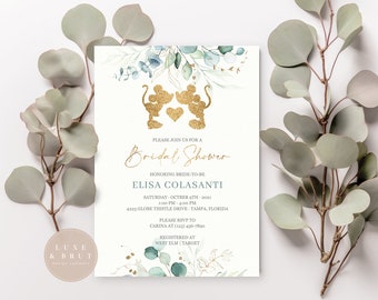 May include: A light blue and gold bridal shower invitation with a watercolor floral design and a gold silhouette of Mickey Mouse and Minnie Mouse. The text reads "Please join us for a Bridal Shower honoring Bride-to-be Elisa Colasanti. Saturday, October 9th, 2021, 12:00 PM - 4:00 PM, 4223 Globe Thistle Drive, Tampa, Florida. Please RSVP to Carina at (123) 456-7890. Registered at West Elm | Target."