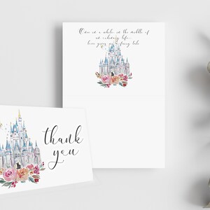May include: White folded thank you cards with a watercolor castle design, surrounded by pink and red flowers. One card has the words "thank you" in black script. The other card has the text "Once in a while...fairy tale."