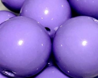 May include: Close-up of several large, round, lavender-colored beads. The beads have a glossy finish and reflect light, creating bright highlights. The beads are clustered together, filling the frame.