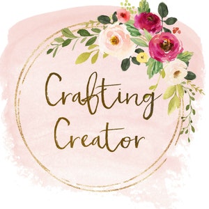 May include: A pink watercolor background with a gold circle frame and the text "Crafting Creator" in gold script. The circle is decorated with a floral wreath of pink, white, and red flowers.