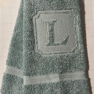 Embossed monogram hand towel.