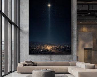 May include: A large canvas print depicting a night scene with a bright star shining down on a town. The star emits a bright beam of light. The town below is illuminated with warm, inviting lights, set against a dark blue sky.