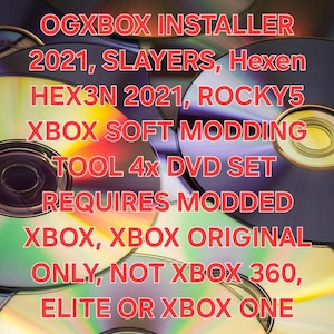 May include: A stack of DVDs with red text, including "OGXBOX INSTALLER" and software names. The discs have a reflective surface. The text specifies compatibility with modded Xbox consoles, excluding Xbox 360, Elite, or Xbox One.