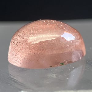 May include: A set of three ceramic mugs with a speckled, matte finish. The mugs are in shades of cream, light gray, and dark gray. Each mug has a simple, minimalist design and a rounded handle.