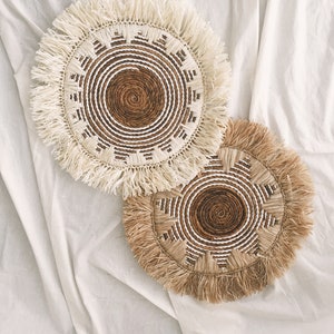 Bohemian Wall Fringe basket made from banana bark in the middle and white seagrass, with raffia fringe. Available in 2 color raffia fringe, natural and bleach raffia. Comes with 50cm or 19.7 inch including Fringe.