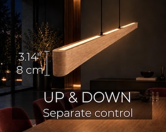 May include: A linear wooden pendant light fixture with integrated LED strips, suspended by two black cords. The light measures 3.14 inches in height. The text UP & DOWN Separate control is visible, indicating independent light source operation.