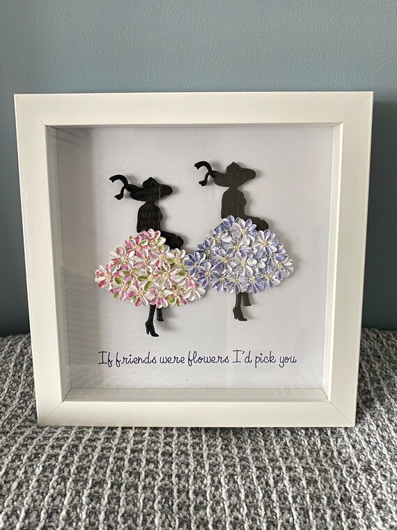 Best Friends-Two silhouette ladies with flower skirts standing together with the quote. “If friends were flowers I’d pick you”