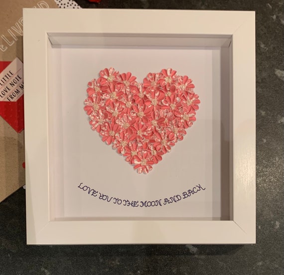 Heart made with beautiful tiny flowers, handmade by myself and then framed.