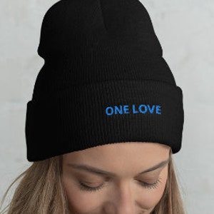 May include: A black beanie with a blue embroidered "ONE LOVE" message.