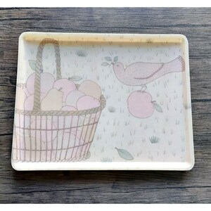 May include: Rectangular serving tray with a pastel illustration of a basket overflowing with apples and pears, a dove holding a sprig, and a single apple. The tray has a light beige background with a white border and a wooden handle.