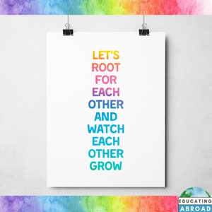 May include: A white poster with the text "Let's root for each other and watch each other grow" in rainbow colors.