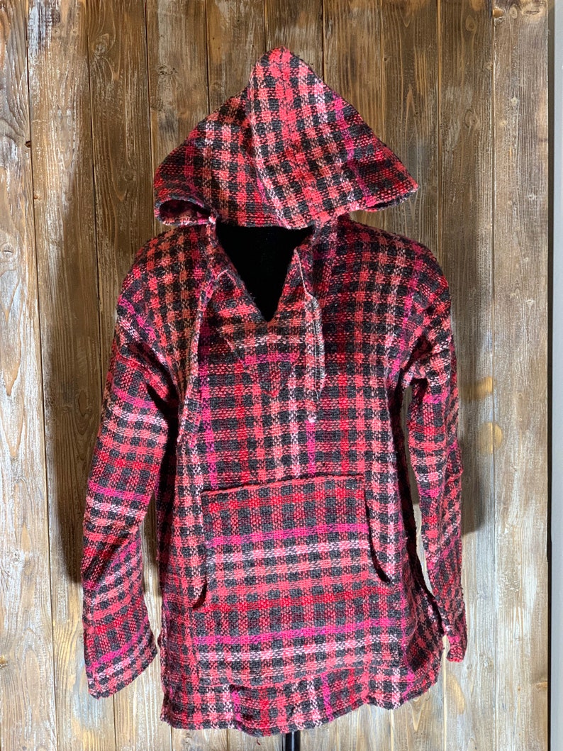 May include: A red, black, and pink plaid hooded sweatshirt with a drawstring hood and a kangaroo pocket.