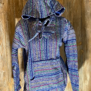 May include: A blue and white striped hooded sweatshirt with a drawstring. The sweatshirt has a pocket on the front and is made of a soft, woven fabric.