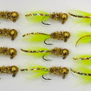 May include: Twelve gold and chartreuse jig heads with a marabou tail. The jig heads are tied with gold tinsel and have a chartreuse marabou tail.