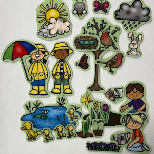 May include: A collection of colorful felt cutouts depicting a spring theme. Includes a sun, rain cloud, tree with birds, children in rain gear, a pond with ducks, and various flowers and insects.