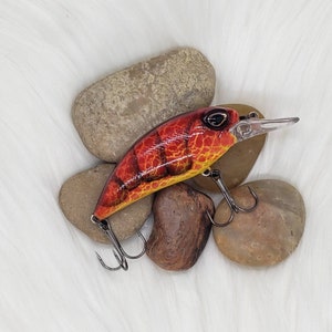 Hot Tomato custom painted crankbait.  Bass fishing, fishing lure. Red, black and yellow painted crank bait.