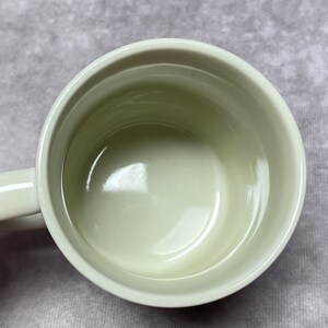 May include: A white ceramic mug with a smooth, glossy interior. The mug is empty and ready to be filled with a hot drink.