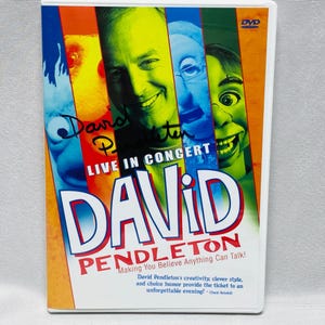 Puede incluir: Caja de DVD para "David Pendleton Live in Concert". La portada presenta un collage de caras en colores vibrantes, con el nombre "DAVID PENDLETON" en letras grandes y en negrita. El texto incluye "Making You Believe Anything Can Talk!"